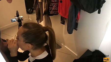 Public Blowjob in a Clothing Store. With Glasses Swallows Cum.