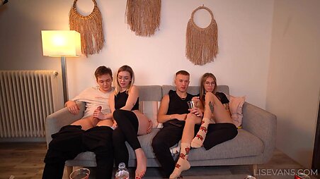 Couple having sex on the couch with friends.